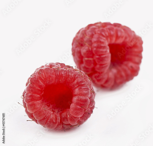 closeup ripe red raspberry on white background