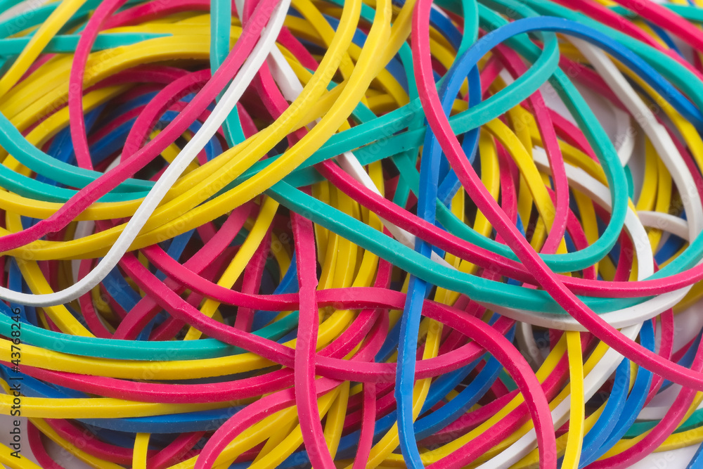 Colourful elastic bands on white background close up Colourful elastic bands on white background close up