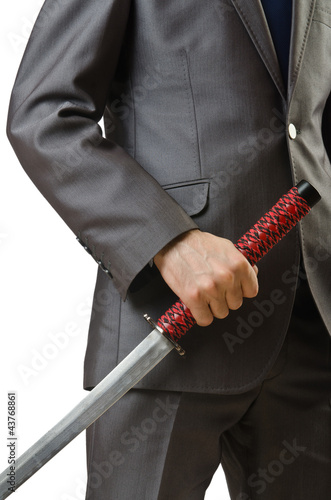 Businessman with sword on white