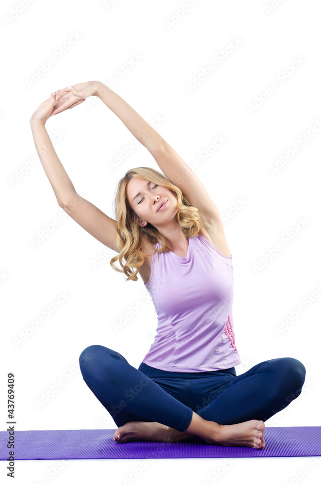 Female sportsman doing exercises on white Female sportsman doing exercises on white