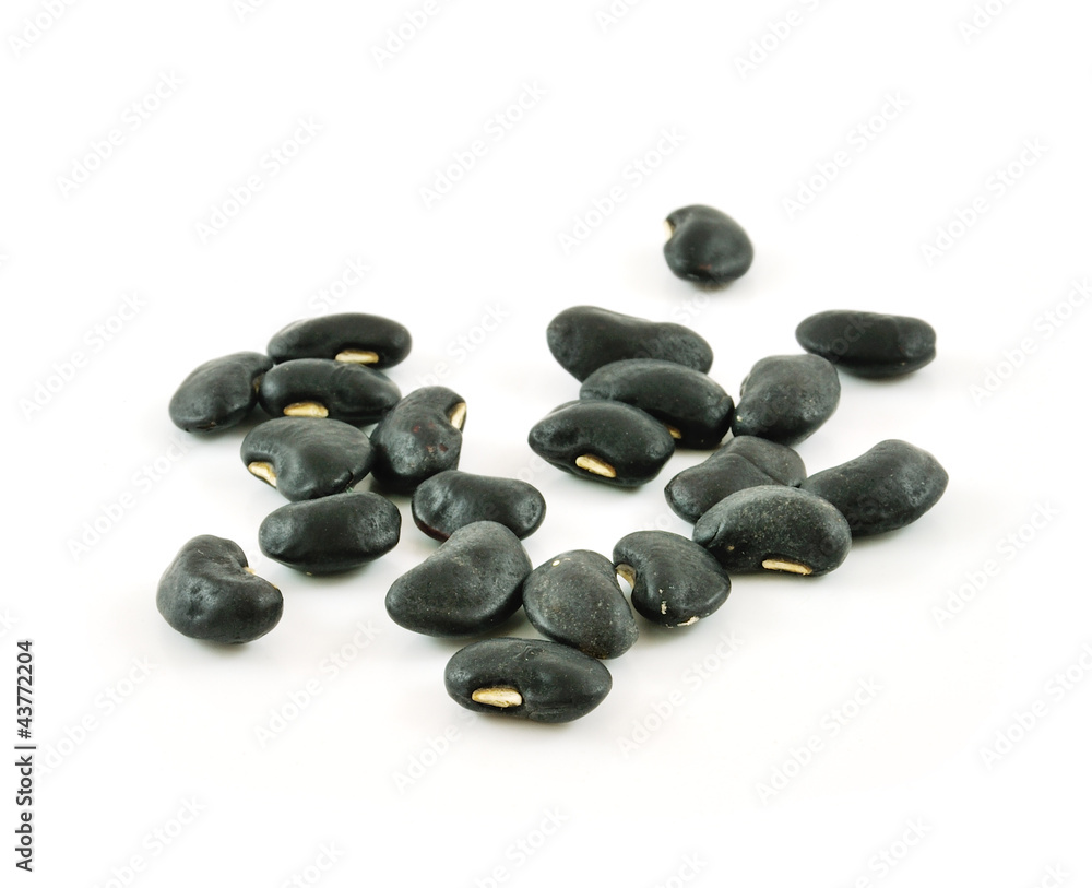 A small handful of black beans - preto. Beans isolated on a whit A small handful of black beans - preto. Beans isolated on a whit