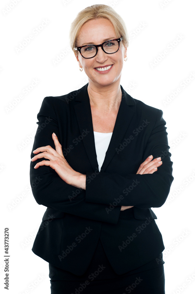 Businesswoman with crossed arms wearing glasses Businesswoman with crossed arms wearing glasses