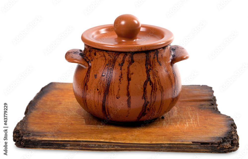 Dirty ceramic pot on old kitchen board Dirty ceramic pot on old kitchen board