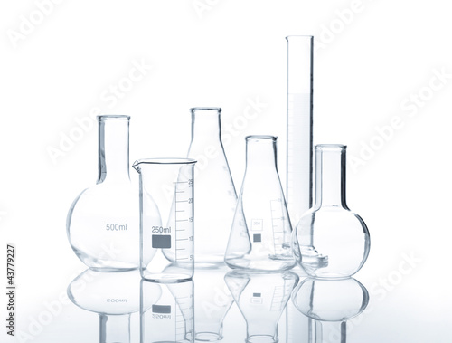 Six empty laboratory flasks with reflection