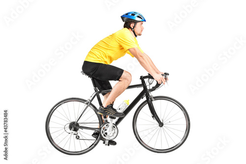 Full length portrait of a man riding a bycicle