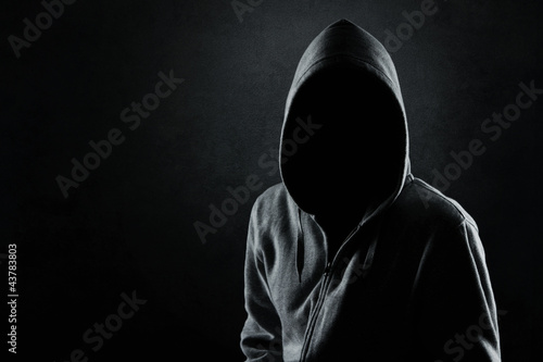 Silhouette of hooded man or hooligan