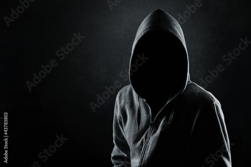 Bild auf Leinwand Silhouette of hooded man or hooligan