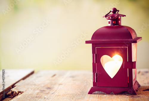 Glowing lantern with a heart photo
