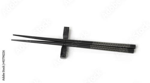 Two black chopsticks isolated