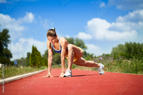 female runner stretching