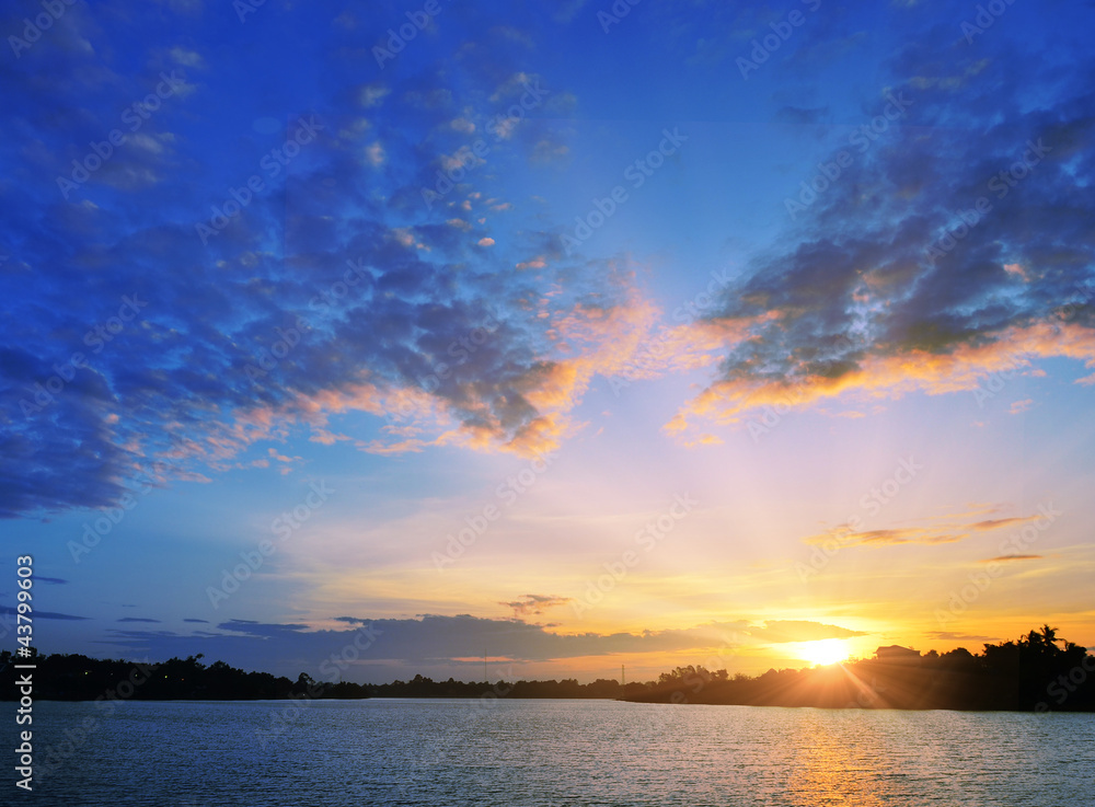 The picturesque colorful sunset into the sea The picturesque colorful sunset into the sea