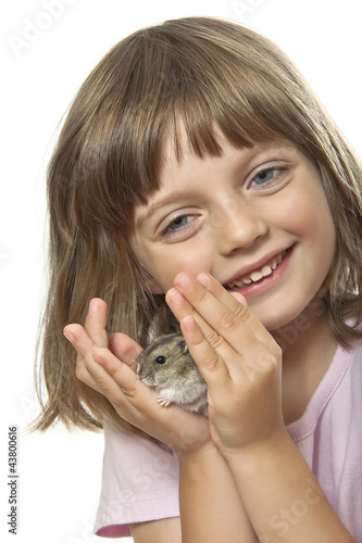 little girl holding hamster her pet animal