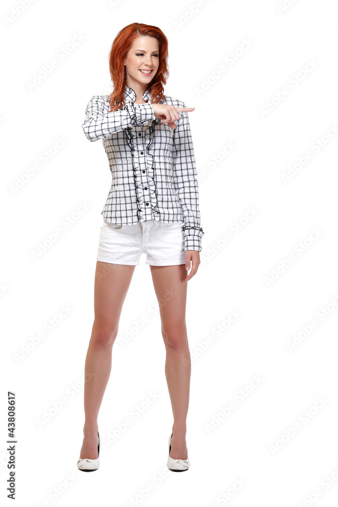 happy redhead woman pointing at copyspace happy redhead woman pointing at copyspace