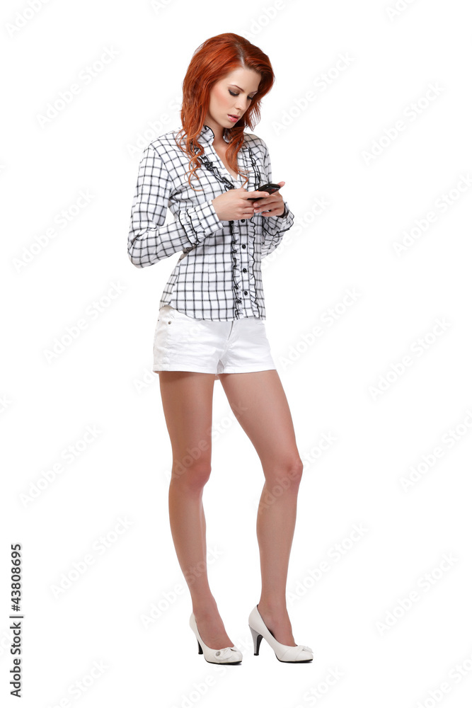 redhead woman reading her short message on cellphone redhead woman reading her short message on cellphone