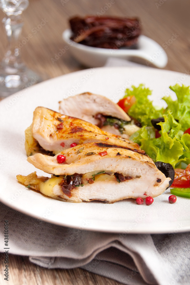 Grilled chicken stuffed with mozzarella and dried tomatoes Grilled chicken stuffed with mozzarella and dried tomatoes