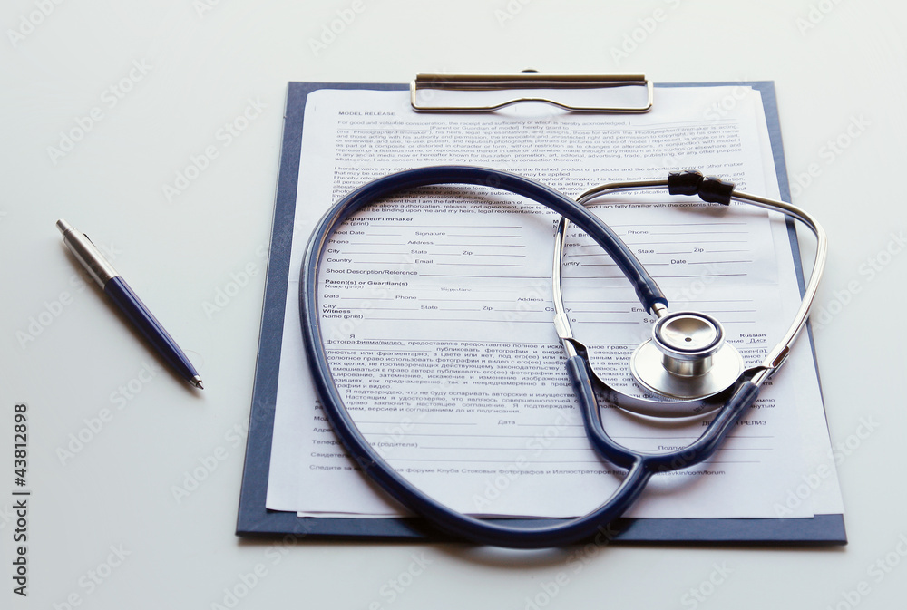 Closeup of a stethoscope on a rx prescription Closeup of a stethoscope on a rx prescription