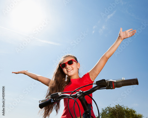 teenage girl on a bicycle
