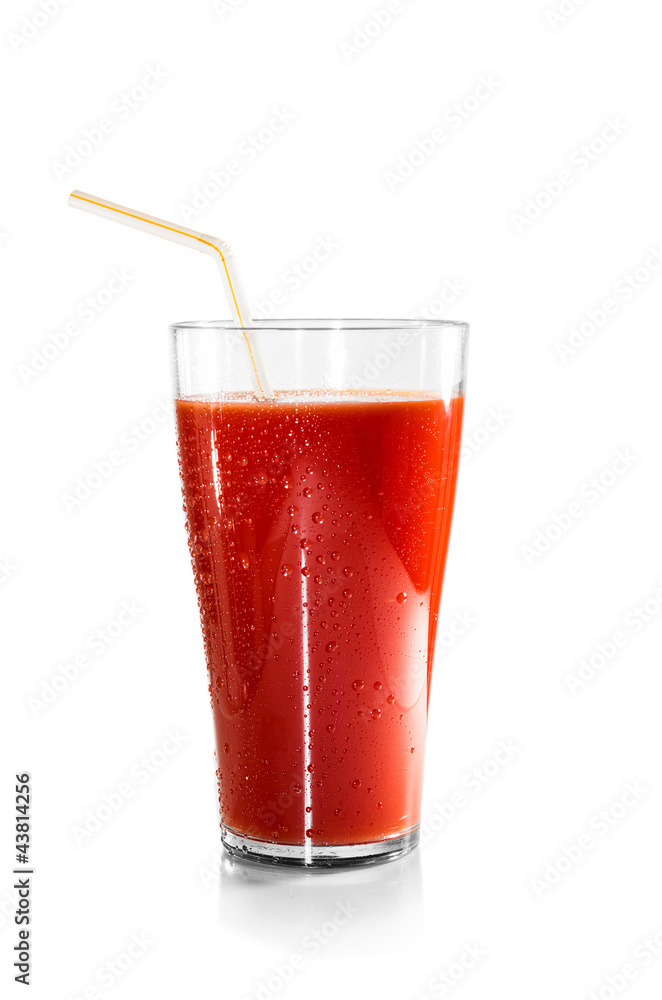 Glass of tomato juice and a straw isolated Glass of tomato juice and a straw isolated