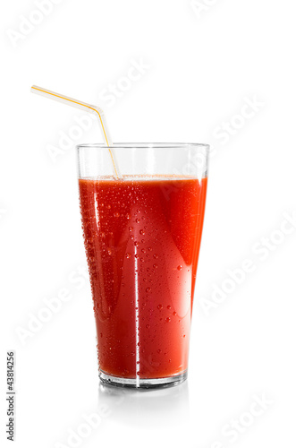 Glass of tomato juice and a straw isolated