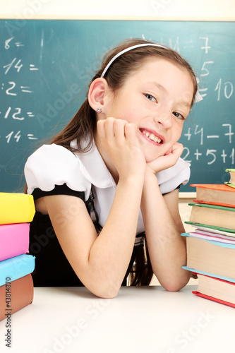 little schoolgirl and books...