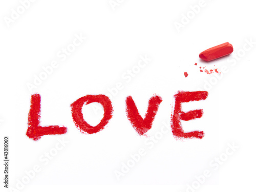 word LOVE and red pastel crayon