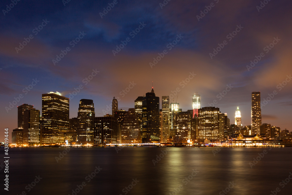 Manhattan skyline by night from Brooklyn bridge park