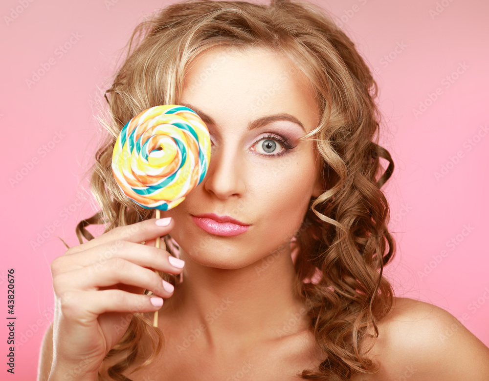 young happy woman with lollipop
