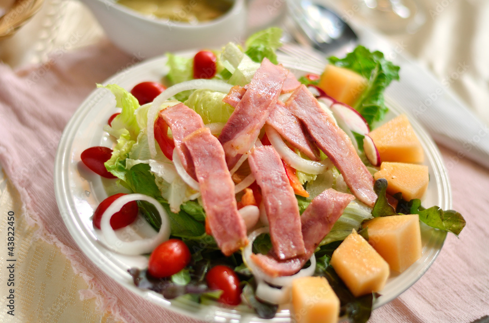 Fresh salad from vegetables, cheese and ham Fresh salad from vegetables, cheese and ham