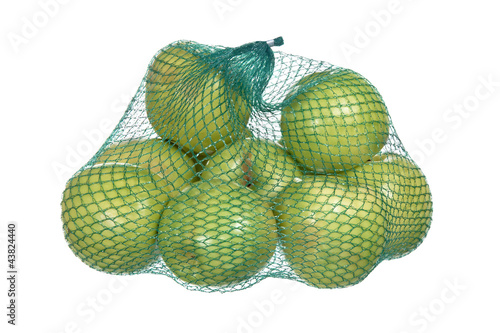 bag of green apples isolated on white