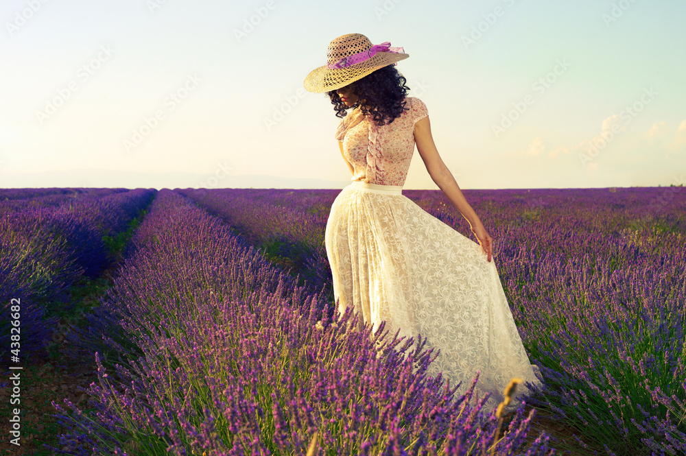 Naklejka premium Romantic woman in fairy lavender fields