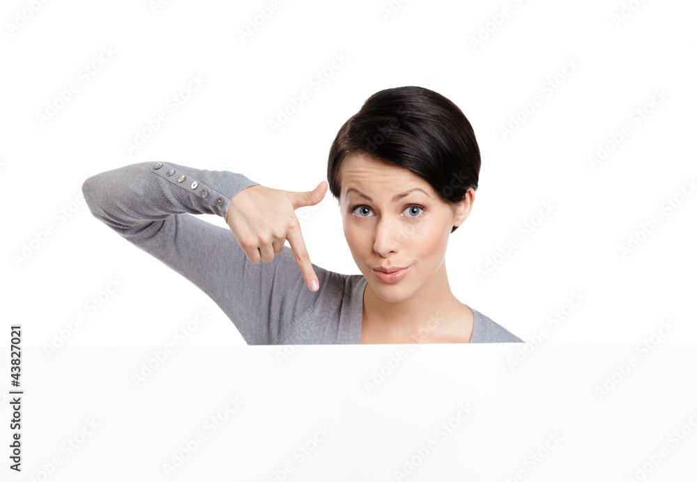 Young woman points down with finger , isolated on white Young woman points down with finger , isolated on white