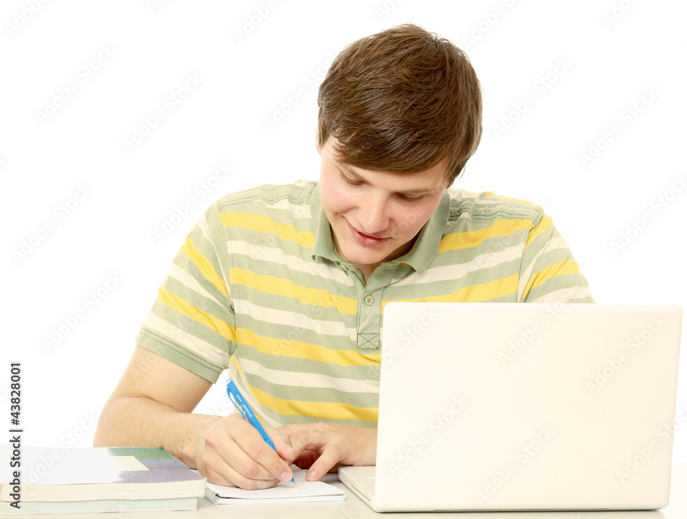 A young guy studying isolated on white background A young guy studying isolated on white background