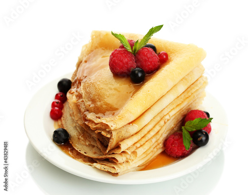 Delicious pancakes with berries and honey