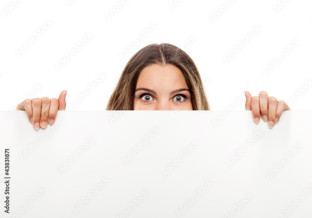 Portrait of a young woman with blank billboard Portrait of a young woman with blank billboard