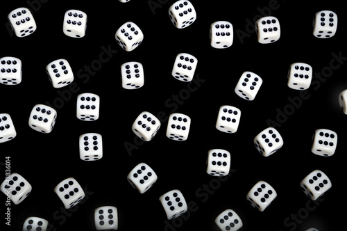 Gambling background - white dice on black background