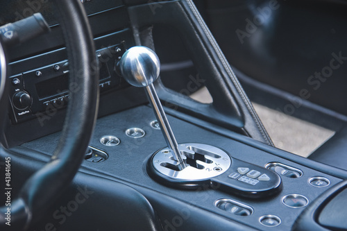 Gear shift lever in exotic Italian sportscar © Christian Delbert