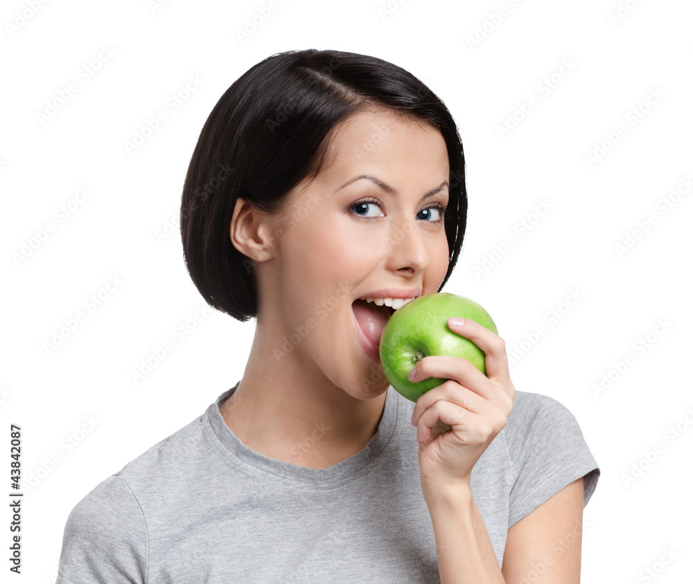 Young vegetarian lady with green apple, isolated Young vegetarian lady with green apple, isolated