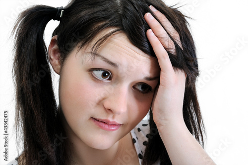 pensive young woman looking away