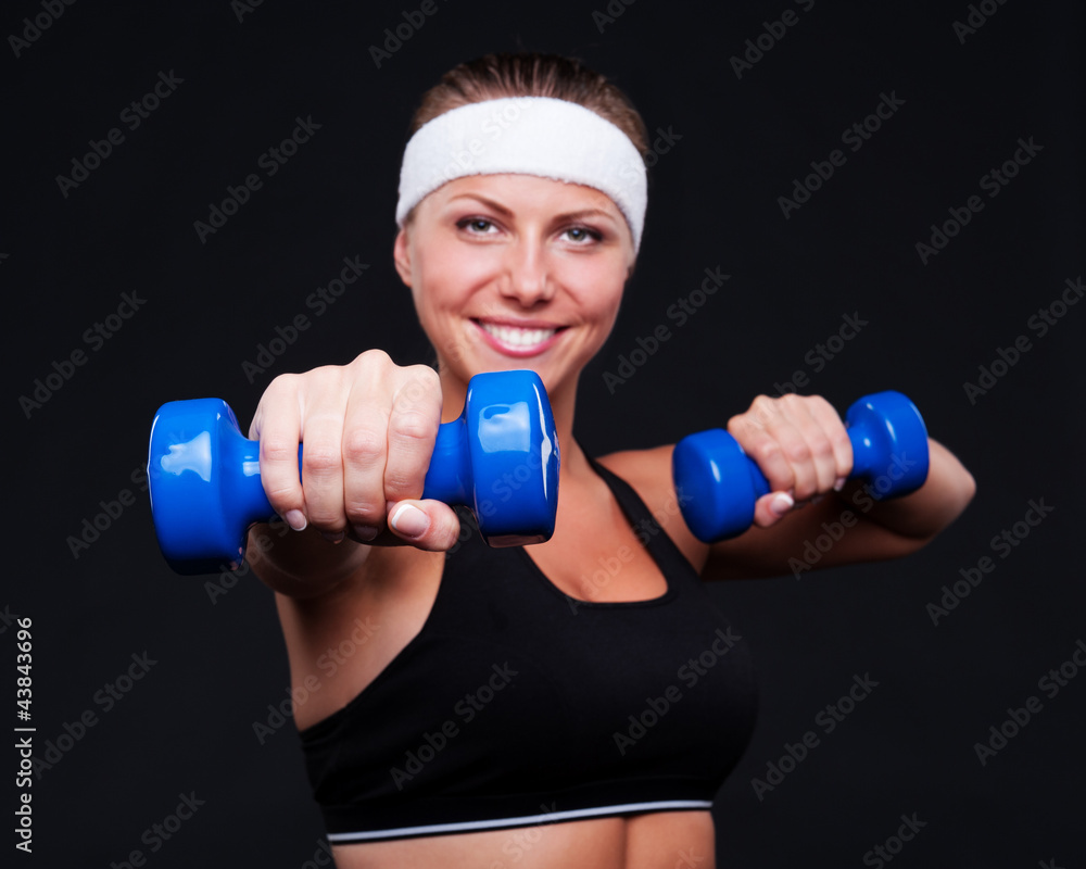 female doing exercises with dumbbells female doing exercises with dumbbells