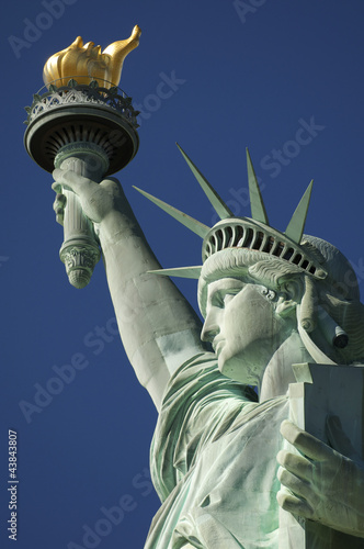 Close-up Portrait of Statue of Liberty Bright Blue Sky © lazyllama