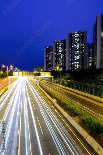 traffic with blur light through city at night