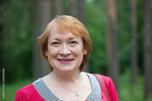 Outdoor portrait of  mature woman photo