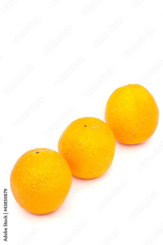 three oranges on white paper three oranges on white paper