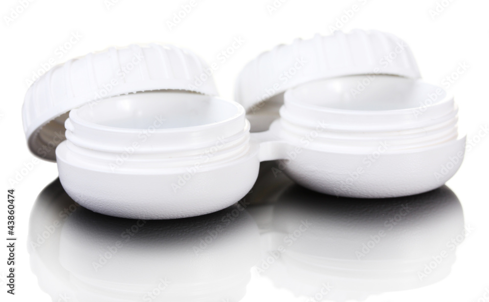 contact lenses in containers on grey background contact lenses in containers on grey background