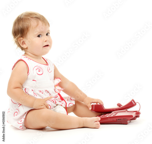 Cute baby with telephone is...