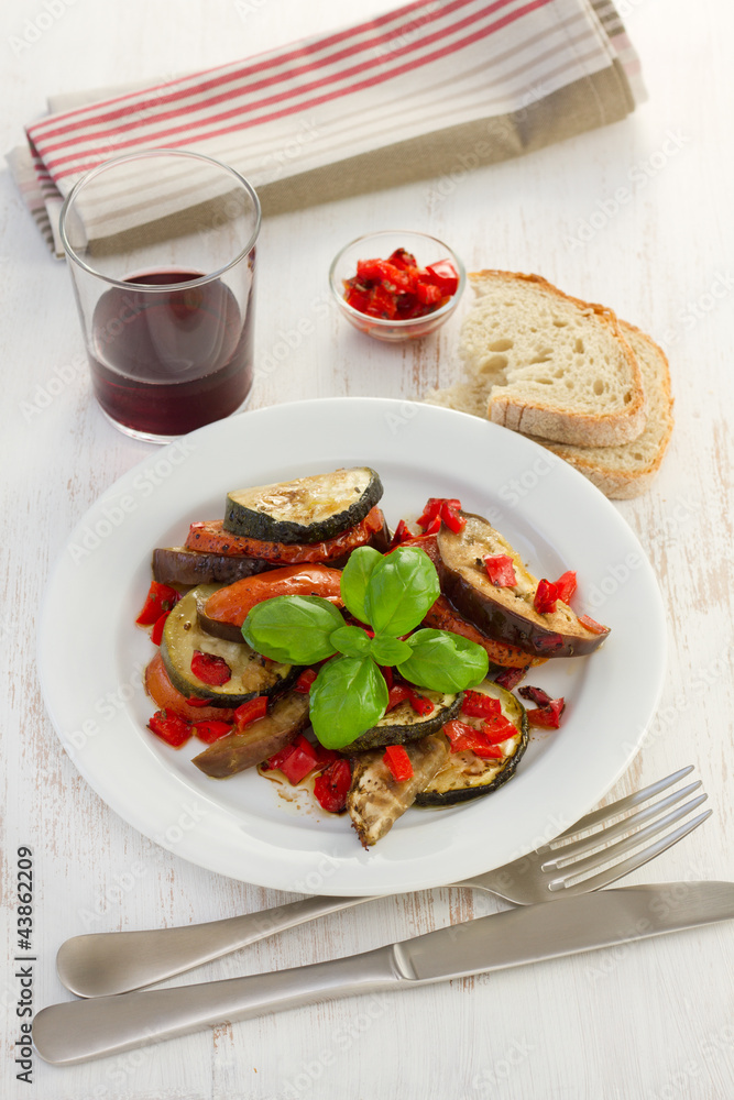 ratatouille with basil on the white plate ratatouille with basil on the white plate