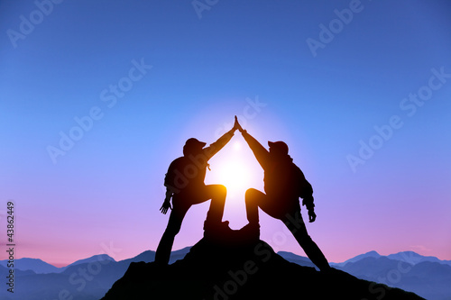 Obraz na plátne two man with success gesture  on mountain