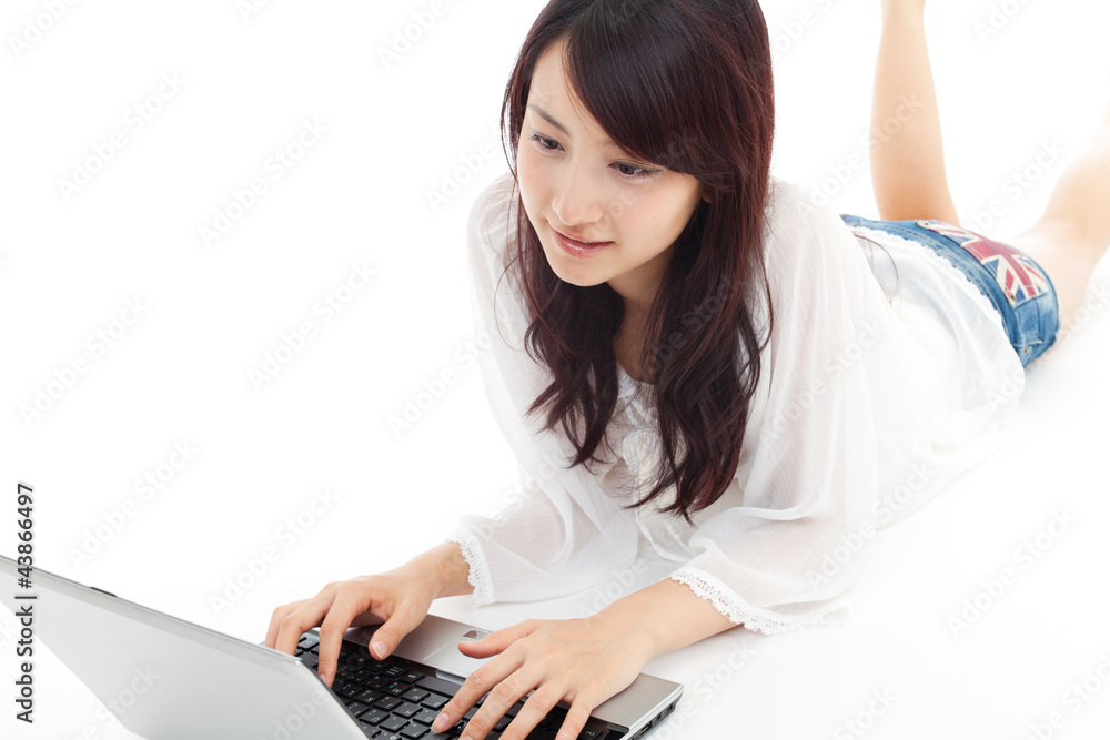 Beautiful young woman using a laptop computer. Beautiful young woman using a laptop computer.