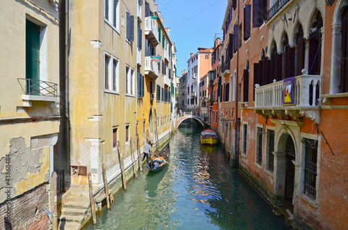 typical urban view with canal, boats and houses in Venice © cescassawin