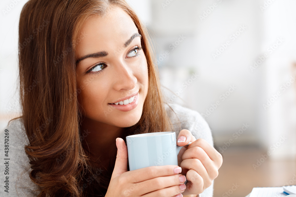 attractive young woman drinking coffee at home attractive young woman drinking coffee at home
